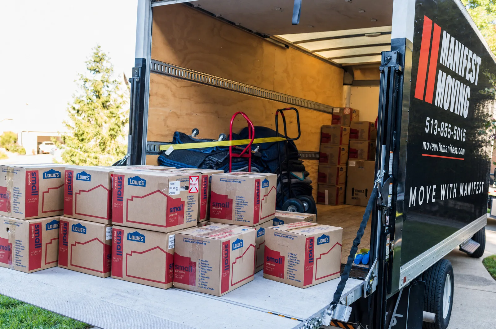 Manifest Moving truck packed with labeled boxes